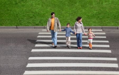 Family crossing the street