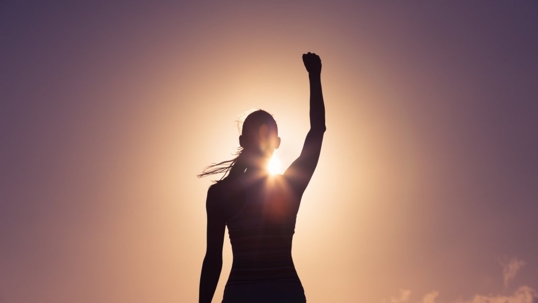 Woman holding fist in air