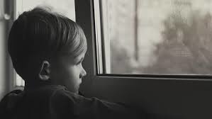 kid looking out a window